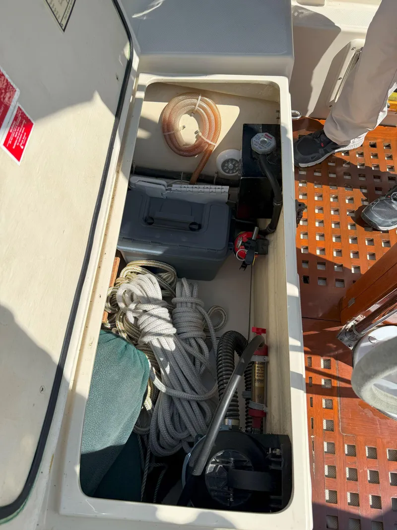 Slide: The Image of Storage compartment on a 1993 Pacific Seacraft Crealock 34 sailboat, containing ropes and equipment. - 19
