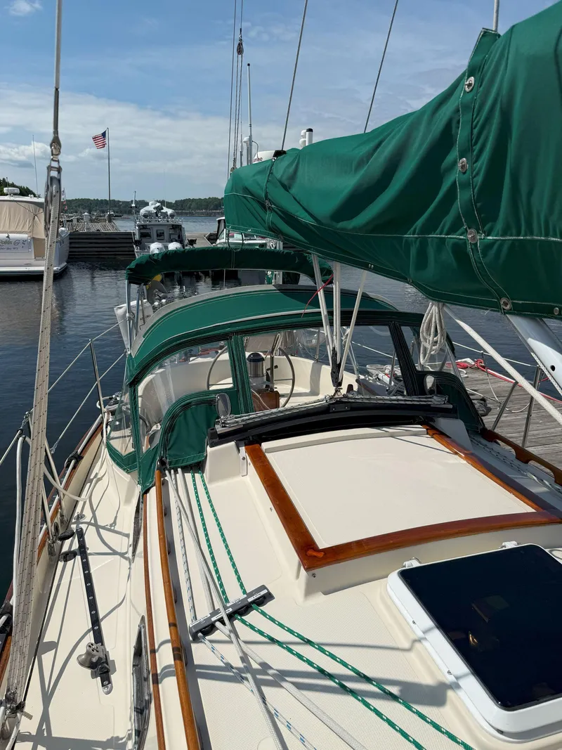 Slide: The Image of Sailboat docked at marina, Pacific Seacraft Crealock 34, 1993 model, with green canvas covers. - 25