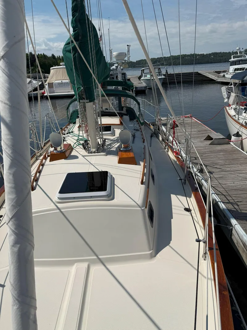 Slide: The Image of Sailboat docked at marina, Pacific Seacraft Crealock 34, 1993 model, with green sail cover. - 30