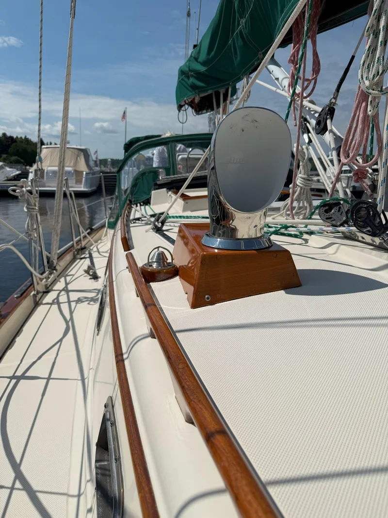 Slide: The Image of Pacific Seacraft Crealock 34 sailboat deck, 1993 model, with polished fittings and green rigging. - 31