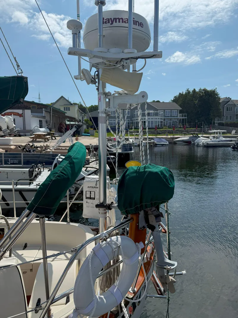 Slide: The Image of Sailboat docked at marina, featuring Raymarine equipment, Pacific Seacraft Crealock 34, 1993 model. - 8