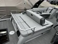 Slide: The Image of 2025 Bennington 25 QXSBA boat interior with luxurious seating and sleek design. - 11