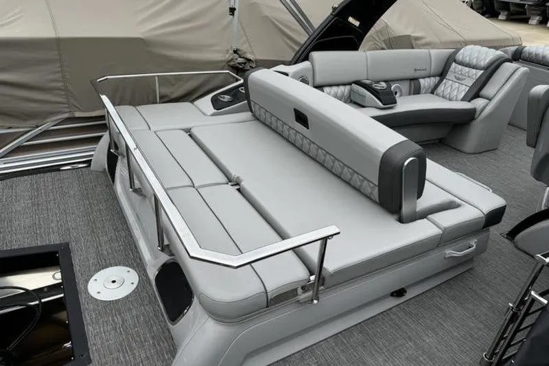 Slide: The Image of 2025 Bennington 25 QXSBA boat interior with luxurious gray seating and modern design. - 13