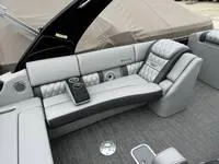 Slide: The Image of 2025 Bennington 25 QXSBA boat interior with luxurious gray seating and modern design. - 9