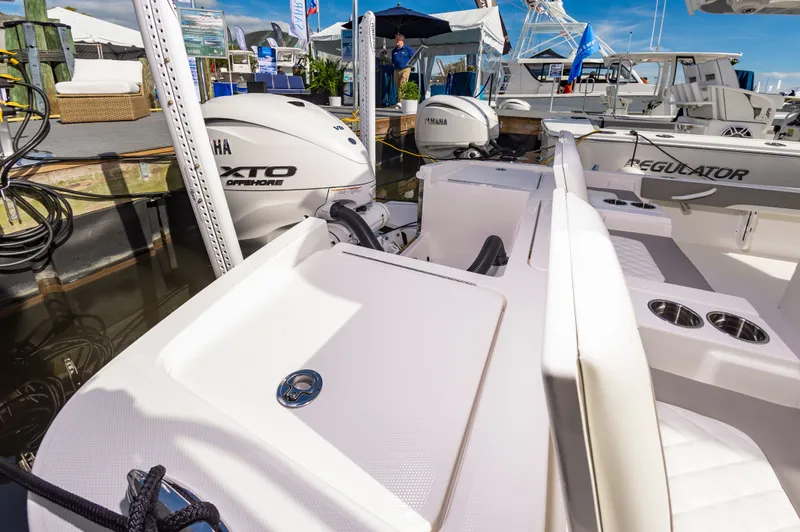 Slide: The Image of 2026 Regulator 26XO boat with Yamaha XTO Offshore engine at a marina. - 10