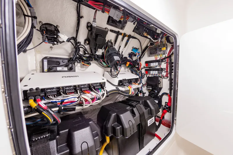 Slide: The Image of Electrical system inside a 2026 Regulator 26XO boat, showcasing wiring and components. - 19