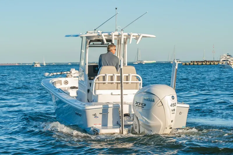 Slide: The Image of 2026 Regulator 26XO boat cruising on open water, featuring Yamaha 450 V8 engine. - 3