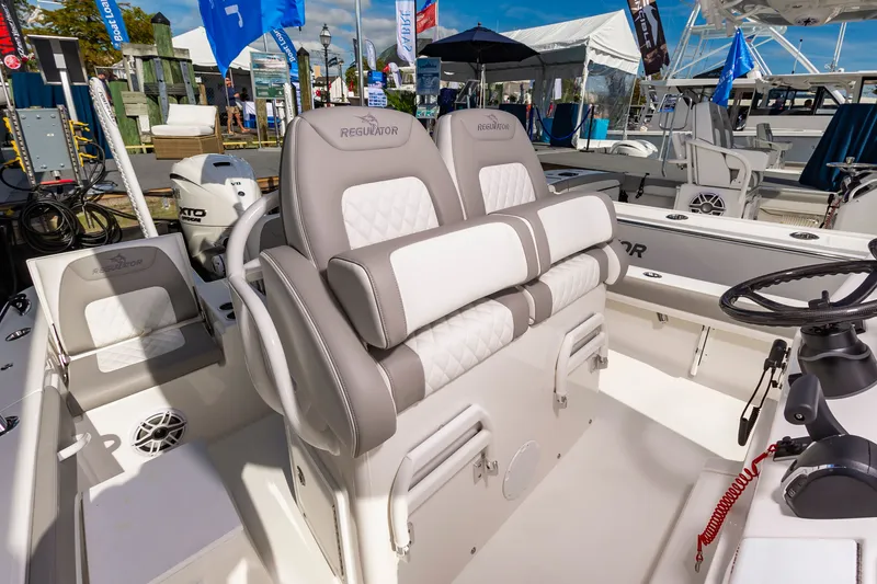 Slide: The Image of 2026 Regulator 26XO boat interior with plush seating and modern controls. - 6