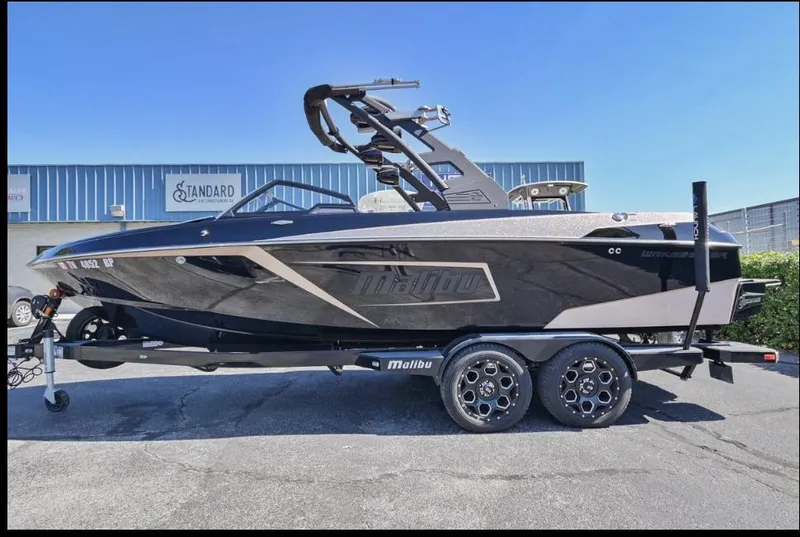 Slide: The Image of 2020 Malibu Wakesetter 23 LSV boat on trailer, parked outdoors. - 3