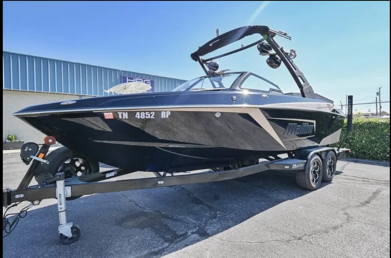 Slide: The Image of 2020 Malibu Wakesetter 23 LSV boat on trailer, parked outdoors. - 4