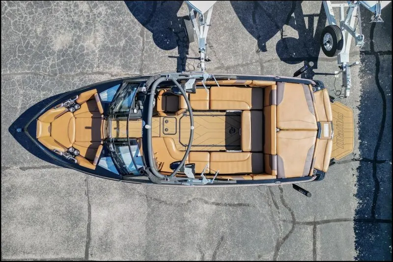 Slide: The Image of 2020 Malibu Wakesetter 23 LSV boat, aerial view, tan interior, parked on pavement. - 5