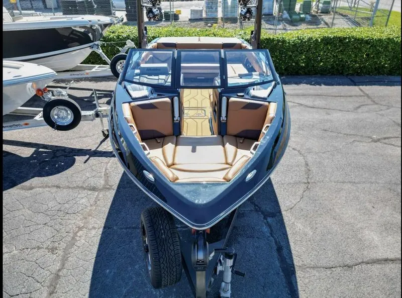 Slide: The Image of 2020 Malibu Wakesetter 23 LSV boat on trailer, featuring sleek design and spacious seating. - 7