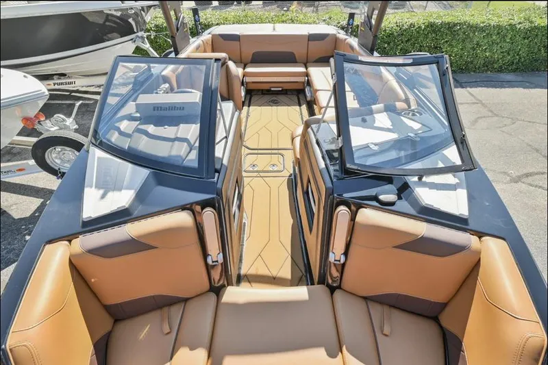 Slide: The Image of 2020 Malibu Wakesetter 23 LSV interior with tan seating and open windshield. - 9