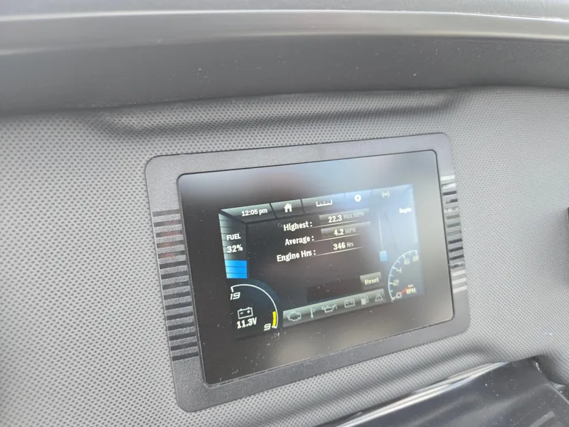 Slide: The Image of Dashboard display of a 2021 Yamaha Boats SX195 showing fuel level and engine hours. - 18