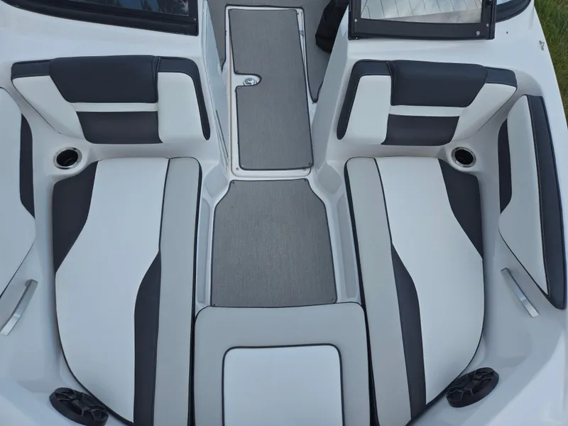 Slide: The Image of 2021 Yamaha Boats SX195 interior seating with gray and black upholstery. - 20
