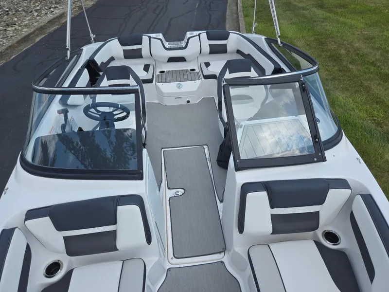Slide: The Image of 2021 Yamaha Boats SX195 interior with sleek seating and modern dashboard design. - 21
