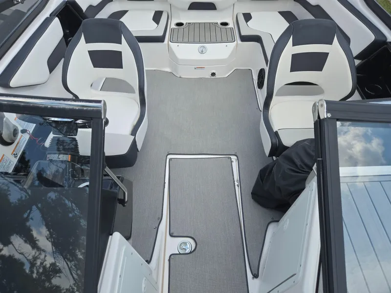 Slide: The Image of 2021 Yamaha Boats SX195 interior with seating and storage compartments. - 22