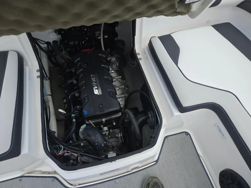 Slide: The Image of 2021 Yamaha Boats SX195 engine compartment with SVHO engine visible. - 24