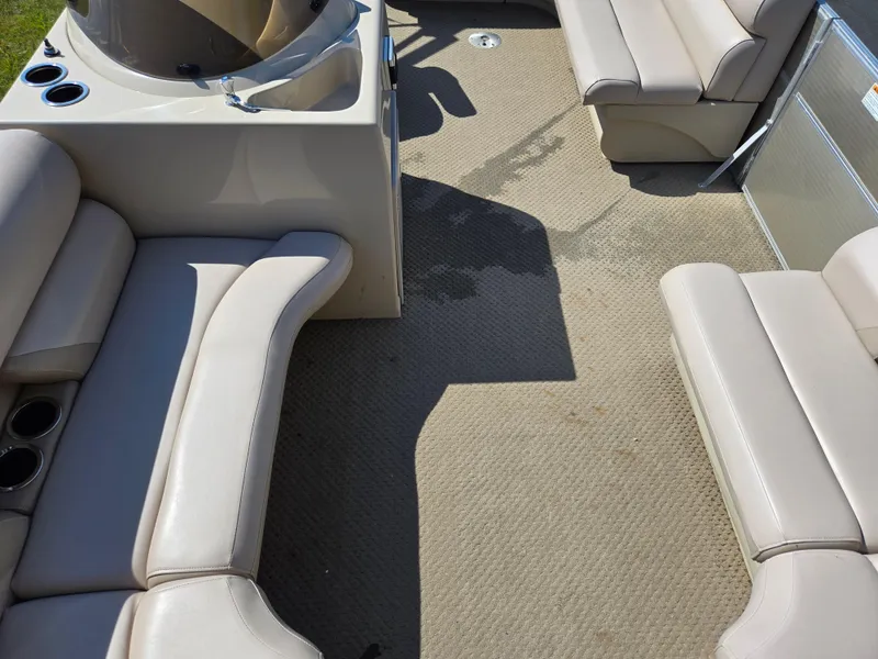 Slide: The Image of 2013 Starcraft Stardeck 190 Cruise interior with beige seating and carpeted floor. - 14