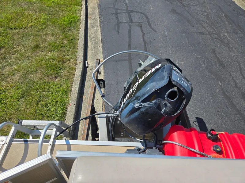 Slide: The Image of 2013 Starcraft Stardeck 190 Cruise boat with Mercury outboard motor and red fuel tank. - 18