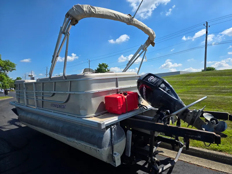 Slide: The Image of 2013 Starcraft Stardeck 190 Cruise pontoon boat with outboard motor on trailer. - 3