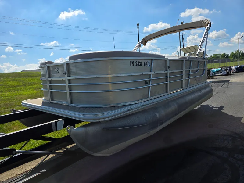 Slide: The Image of 2013 Starcraft Stardeck 190 Cruise pontoon boat on trailer under blue sky. - 5