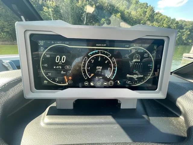 Slide: The Image of Dashboard of a 2023 Malibu M240 boat displaying speed, RPM, and other controls. - 5