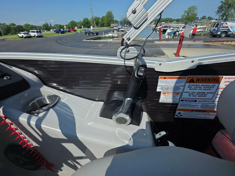 Slide: The Image of 2021 Bennington Q 23 Swingback boat dashboard with steering wheel and controls. - 7
