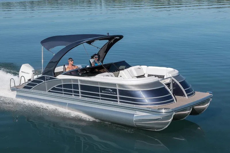 Slide: The Image of Interior view of a 2021 Bennington Q 23 Swingback boat with control panel and warning labels. - 15