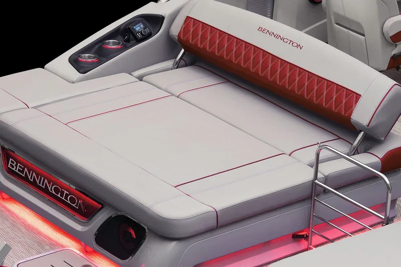 Slide: The Image of 2021 Bennington Q 23 Swingback pontoon boat at a lakeside dock under a clear blue sky. - 19