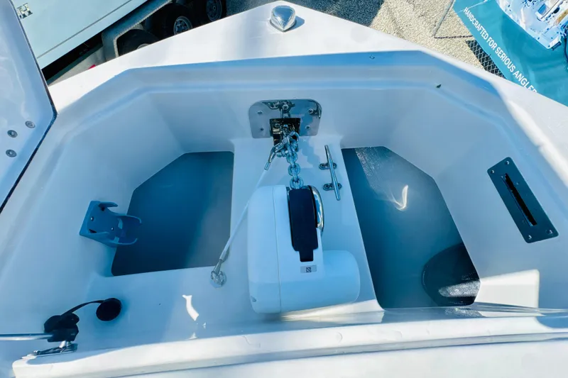 Slide: The Image of 2026 Sailfish 252 CC boat anchor compartment with chain and winch system. - 15