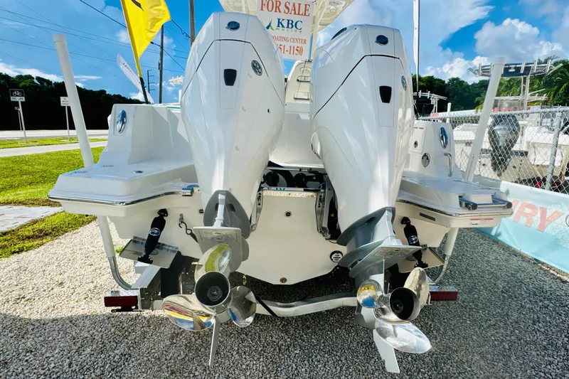 Slide: The Image of 2026 Sailfish 252 CC boat with dual outboard motors, displayed for sale. - 4