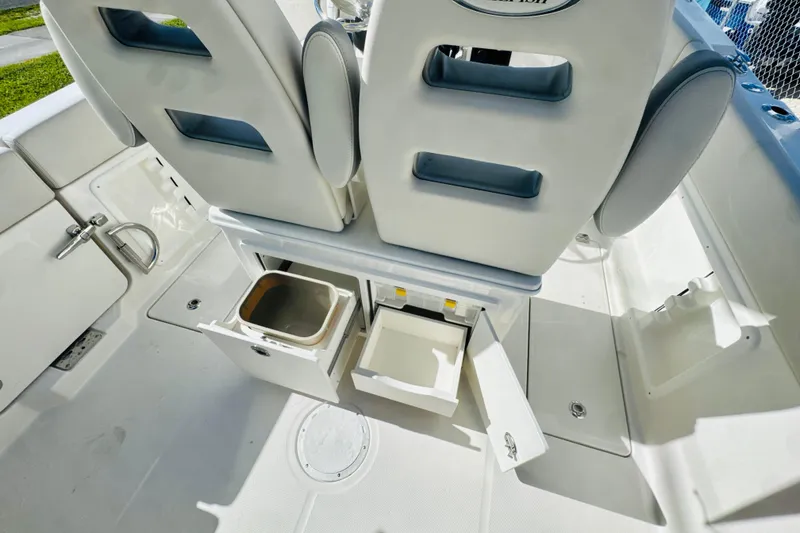 Slide: The Image of 2026 Sailfish 252 CC boat interior with storage compartments and seating. - 9