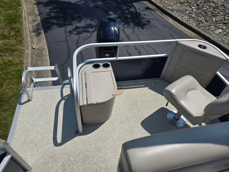 Slide: The Image of 2019 Bennington 188 SFV pontoon boat deck with seating and storage. - 14
