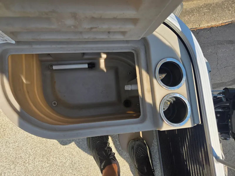 Slide: The Image of Open storage compartment with cup holders on a 2019 Bennington 188 SFV boat. - 15
