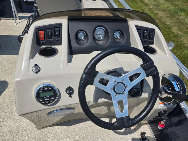 Slide: The Image of Steering console of a 2019 Bennington 188 SFV boat with gauges and controls. - 17
