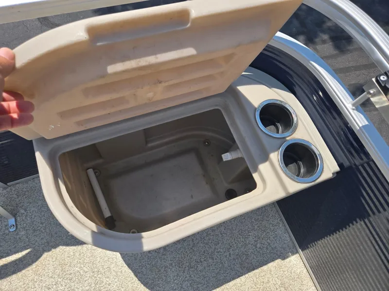 Slide: The Image of Open storage compartment with cup holders on a 2019 Bennington 188 SFV boat. - 20