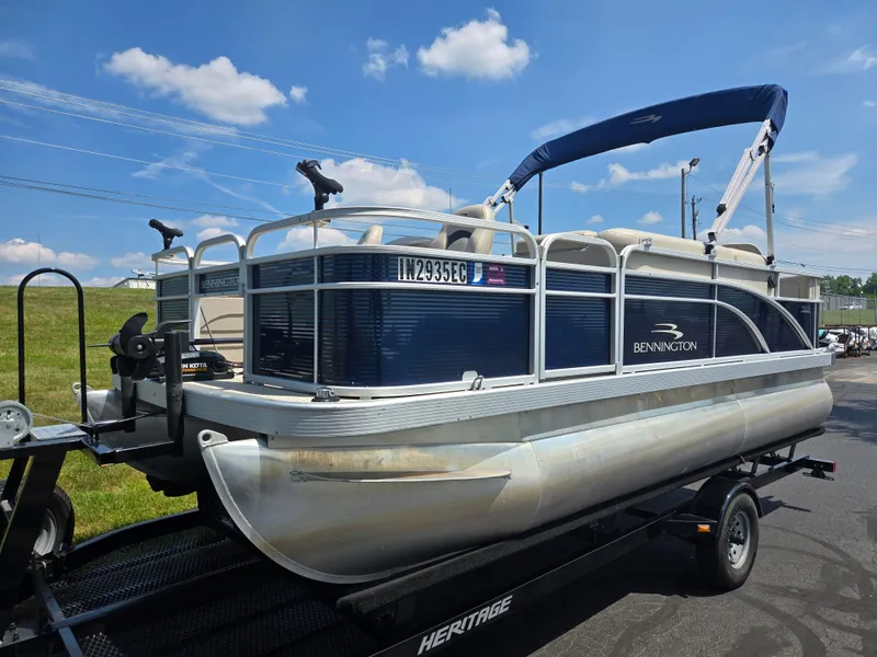 Slide: The Image of 2019 Bennington 188 SFV pontoon boat on trailer under blue sky. - 5