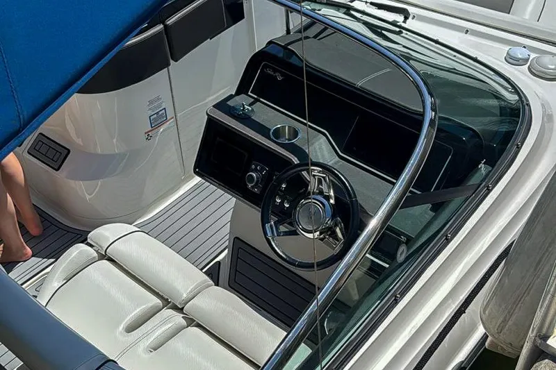 Slide: The Image of Luxurious seating area on a 2018 Sea Ray SLX 310 boat, featuring elegant upholstery. - 13