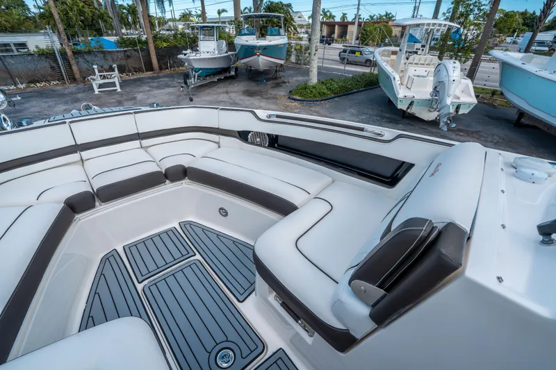 Slide: The Image of 2018 Sea Ray SLX 310 boat interior with luxurious seating and sleek design. - 25
