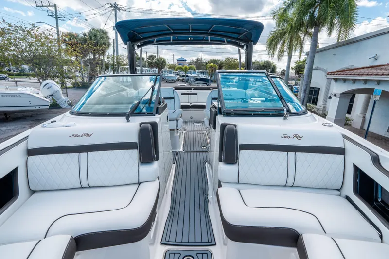 Slide: The Image of 2018 Sea Ray SLX 310 boat interior with luxurious seating and sleek design. - 28