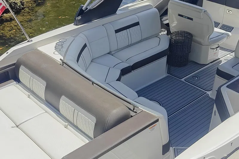 Slide: The Image of 2018 Sea Ray SLX 310 boat on trailer at Marine Connection dealership. - 8