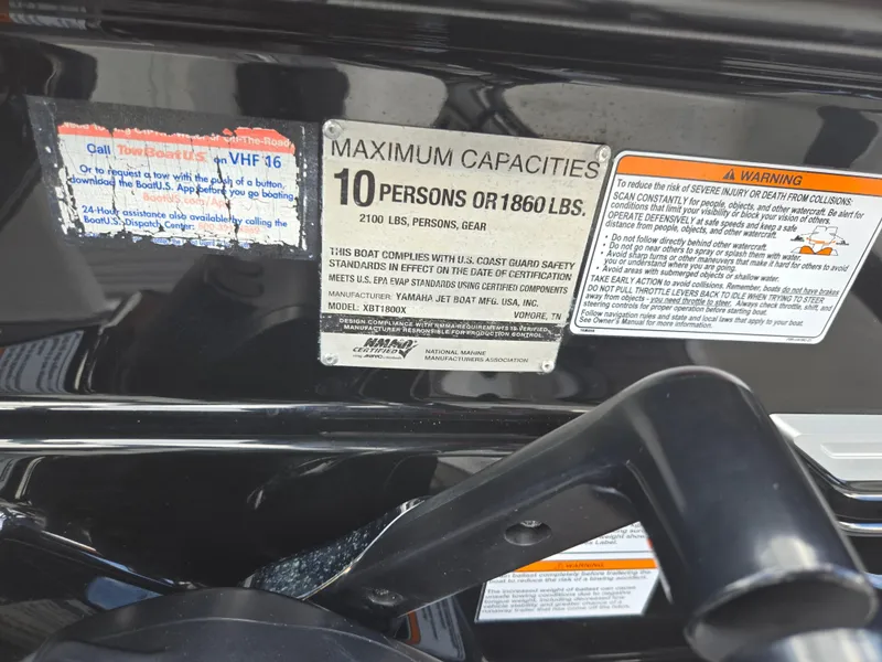 Slide: The Image of 2018 Yamaha Boats 212X capacity label, maximum 10 persons or 1860 lbs, safety warnings visible. - 13