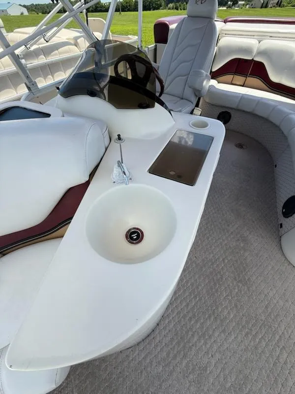 Slide: The Image of Interior of 2005 Avalon EXCALIBER 2325 boat with seating and sink. - 10