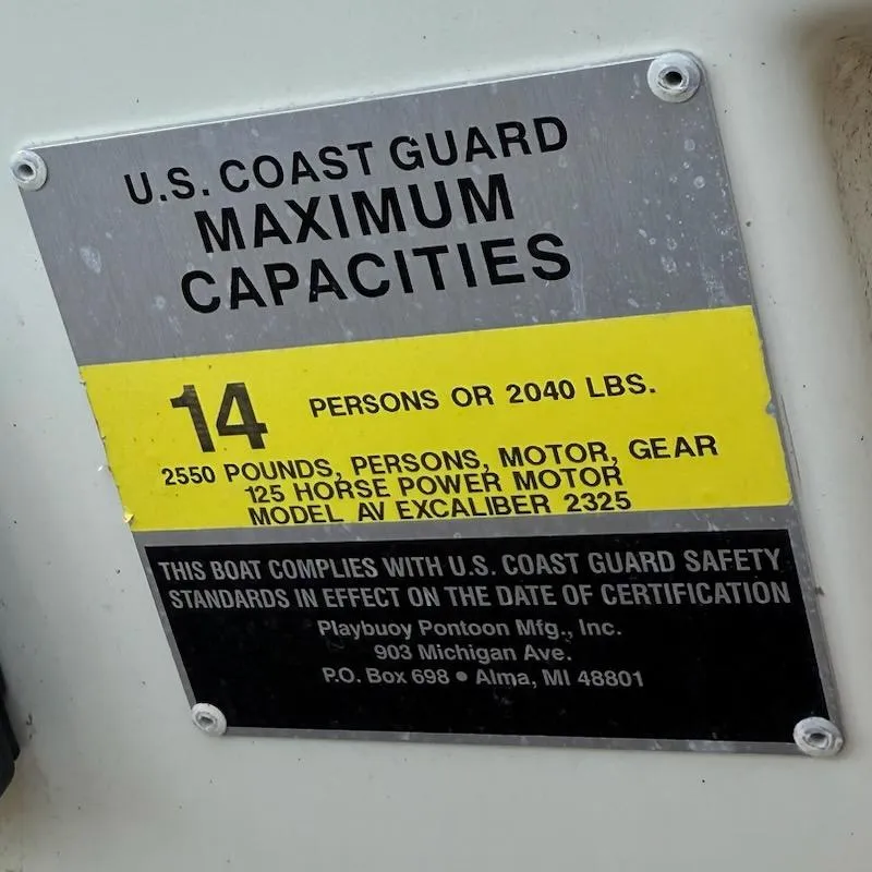 Slide: The Image of U.S. Coast Guard capacity plate for Avalon EXCALIBER 2325, 14 persons or 2040 lbs, 2005 model. - 13
