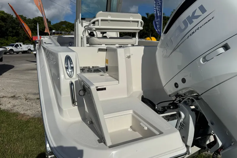 Slide: The Image of 2026 Sailfish 232 CC boat with Suzuki outboard motor, rear deck view. - 11