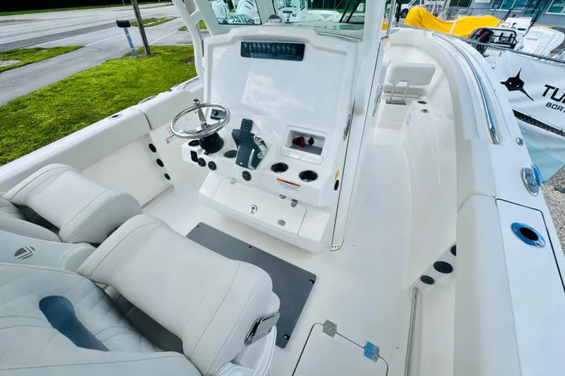 Slide: The Image of 2026 Sailfish 272 CC boat interior with modern helm and seating. - 14