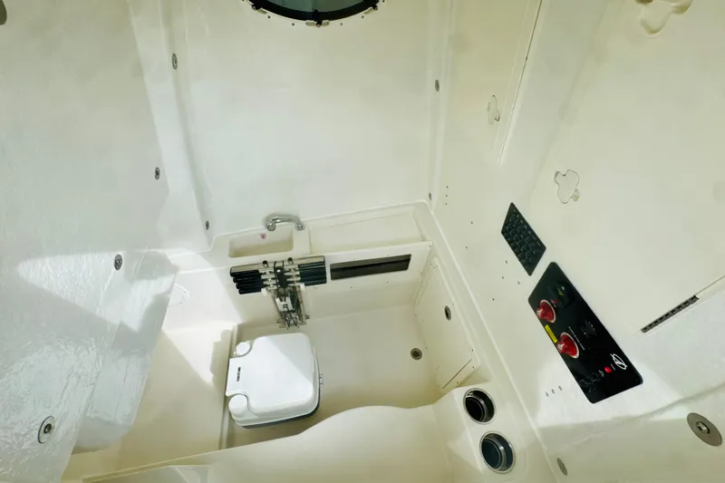 Slide: The Image of 2026 Sailfish 272 CC boat interior with compact toilet and control panel. - 17