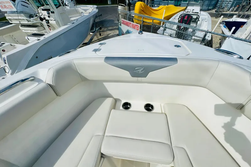 Slide: The Image of 2026 Sailfish 272 CC boat interior with white seating and cup holders. - 20