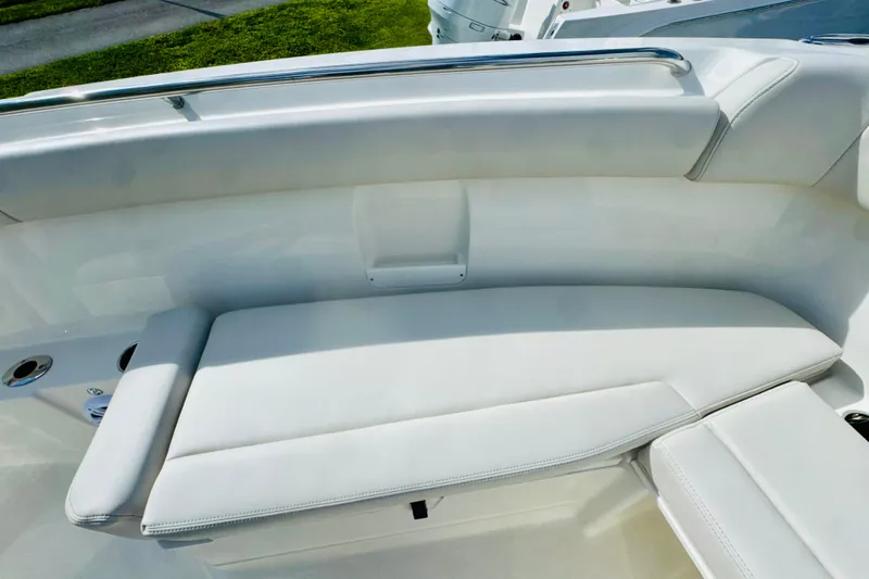 Slide: The Image of 2026 Sailfish 272 CC boat interior with white cushioned seating. - 21